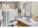 Clean bathroom with a shower-tub combination, white vanity, and tile flooring at 17874 N 93Rd Way, Scottsdale, AZ 85255