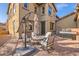 Charming outdoor patio with brick flooring, seating, umbrella, and barbecue grill at 17874 N 93Rd Way, Scottsdale, AZ 85255