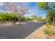 Gated community entrance with lush landscaping, providing security and a welcoming first impression at 18283 N 93Rd St, Scottsdale, AZ 85255