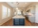 Contemporary kitchen featuring a large island, stainless steel appliances, and custom cabinetry at 18283 N 93Rd St, Scottsdale, AZ 85255