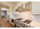 Gourmet kitchen with stainless steel appliances and stylish backsplash at 18283 N 93Rd St, Scottsdale, AZ 85255