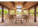 Outdoor seating area with a covered structure offering shade and a gathering space at 18283 N 93Rd St, Scottsdale, AZ 85255