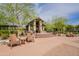 Inviting outdoor seating area with comfortable chairs and a shaded pavilion for relaxation at 18283 N 93Rd St, Scottsdale, AZ 85255