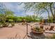 Community playground area with slides and play structures surrounded by trees and flowers at 18283 N 93Rd St, Scottsdale, AZ 85255