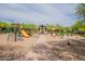 Community playground featuring play structures, swings, and a covered seating area at 18283 N 93Rd St, Scottsdale, AZ 85255