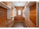 Cedar walk-in closet with adjustable shelving and ample storage space at 18283 N 93Rd St, Scottsdale, AZ 85255