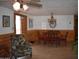 Bright dining room with decorative chandelier, wood trim, and a floral armchair at 201 S Greenfield Rd # 331, Mesa, AZ 85206
