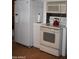 Well-equipped kitchen featuring white appliances, perfect for home cooking at 201 S Greenfield Rd # 331, Mesa, AZ 85206