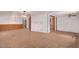 Open living room with tile floors, ceiling fans, and paneled walls for a cozy atmosphere at 201 S Greenfield Rd # 331, Mesa, AZ 85206