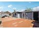 Exterior shot of a well-maintained backyard with brick patio and landscaping at 2118 E Oak St, Phoenix, AZ 85006