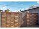 The backyard boasts a brick wall with wood gate creating a private outdoor space at 2118 E Oak St, Phoenix, AZ 85006