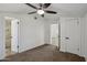 Bedroom features carpet, two doorways and ceiling fan with light at 2118 E Oak St, Phoenix, AZ 85006