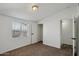 This cozy bedroom features neutral carpet, white walls and closet at 2118 E Oak St, Phoenix, AZ 85006