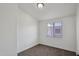 The bedroom features neutral carpet, white walls and a window with blinds at 2118 E Oak St, Phoenix, AZ 85006