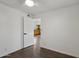 Cozy bedroom with a ceiling fan, wood-look floors and an open doorway to another room at 2118 E Oak St, Phoenix, AZ 85006
