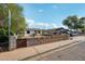 Charming single-story home featuring a well-maintained front yard and mature trees at 2118 E Oak St, Phoenix, AZ 85006