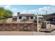 Charming single-story home featuring a well-maintained front yard and a 'Guest House' sign at 2118 E Oak St, Phoenix, AZ 85006