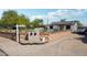 Charming single-story home featuring a well-maintained front yard and a 'Guest House' sign at 2118 E Oak St, Phoenix, AZ 85006