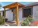 Inviting front entrance with wooden pergola and decorative metal security door with easy access to the house at 2118 E Oak St, Phoenix, AZ 85006