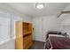 The laundry room features modern washer and dryer units, a shelving unit, and wood-look flooring at 2118 E Oak St, Phoenix, AZ 85006