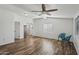 Bright living room featuring new wood flooring, ceiling fan and two accent chairs for a contemporary style at 2118 E Oak St, Phoenix, AZ 85006