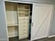 Walk-in closet with custom built-ins, including shelves and drawers at 2138 E Williams Dr, Phoenix, AZ 85024