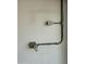 Image features electrical outlets and conduit running on a white wall in a garage or utility space at 2138 E Williams Dr, Phoenix, AZ 85024