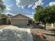 Charming home featuring a two-car garage and mature landscaping in the front yard at 2138 E Williams Dr, Phoenix, AZ 85024