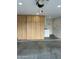 Garage featuring storage cabinets and an adjacent laundry area at 2138 E Williams Dr, Phoenix, AZ 85024