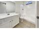 Clean bathroom featuring a shower over bath, a modern vanity, and tiled floor at 2300 E Magma Rd # 74, San Tan Valley, AZ 85143