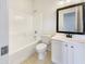 Well-lit bathroom featuring a shower-tub combo, tiled floors, and a vanity sink with a mirror at 2300 E Magma Rd # 74, San Tan Valley, AZ 85143