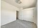 Clean bedroom with neutral walls, carpet, a ceiling fan, and sliding door closet at 2300 E Magma Rd # 74, San Tan Valley, AZ 85143