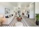 Bright living room featuring neutral decor, ample seating, and stylish striped rug at 2300 E Magma Rd # 74, San Tan Valley, AZ 85143