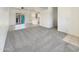 Spacious carpeted living room with ceiling fan and sliding glass door leading to outdoor area at 2300 E Magma Rd # 74, San Tan Valley, AZ 85143