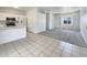 Open living area with tile flooring, kitchen view, and modern lighting at 2300 E Magma Rd # 74, San Tan Valley, AZ 85143