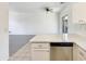 Open-concept design showcases seamless flow between living area and kitchen with stainless steel dishwasher at 2300 E Magma Rd # 74, San Tan Valley, AZ 85143