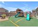 A charming backyard with a playground set, offering a perfect space for children to play and enjoy the outdoors at 23693 W Grove St, Buckeye, AZ 85326