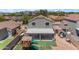 Aerial view of the backyard showcasing a covered patio and a playset at 23693 W Grove St, Buckeye, AZ 85326