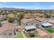 Aerial view of the backyard, showcasing a covered patio and playset at 23693 W Grove St, Buckeye, AZ 85326