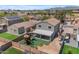 Aerial view of backyard featuring a covered patio, playset and artificial grass at 23693 W Grove St, Buckeye, AZ 85326