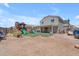 A spacious backyard featuring a playground and covered patio, perfect for Gathering fun and entertaining at 23693 W Grove St, Buckeye, AZ 85326