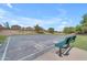 Community basketball court, with bench, perfect for a friendly game at 23693 W Grove St, Buckeye, AZ 85326