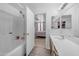 Bathroom featuring a shower, vanity, and access to the main bedroom at 23693 W Grove St, Buckeye, AZ 85326