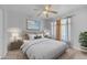 Cozy bedroom with carpet, a ceiling fan and natural light at 23693 W Grove St, Buckeye, AZ 85326