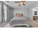 Comfortable bedroom with a ceiling fan and a calming color scheme at 23693 W Grove St, Buckeye, AZ 85326