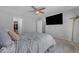 Bedroom features a mounted television and access to a closet at 23693 W Grove St, Buckeye, AZ 85326