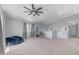 Large bonus room with a workstation, comfortable seating, and carpeted floors at 23693 W Grove St, Buckeye, AZ 85326