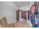 Spacious walk-in closet with ample storage and custom shelving at 23693 W Grove St, Buckeye, AZ 85326