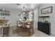 This dining room boasts a wooden table, chandelier and a decorative fish tank at 23693 W Grove St, Buckeye, AZ 85326