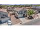 A beautiful two-story home with a well-maintained lawn and a charming front yard tree at 23693 W Grove St, Buckeye, AZ 85326